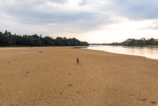 Person walking on a dry riverbed