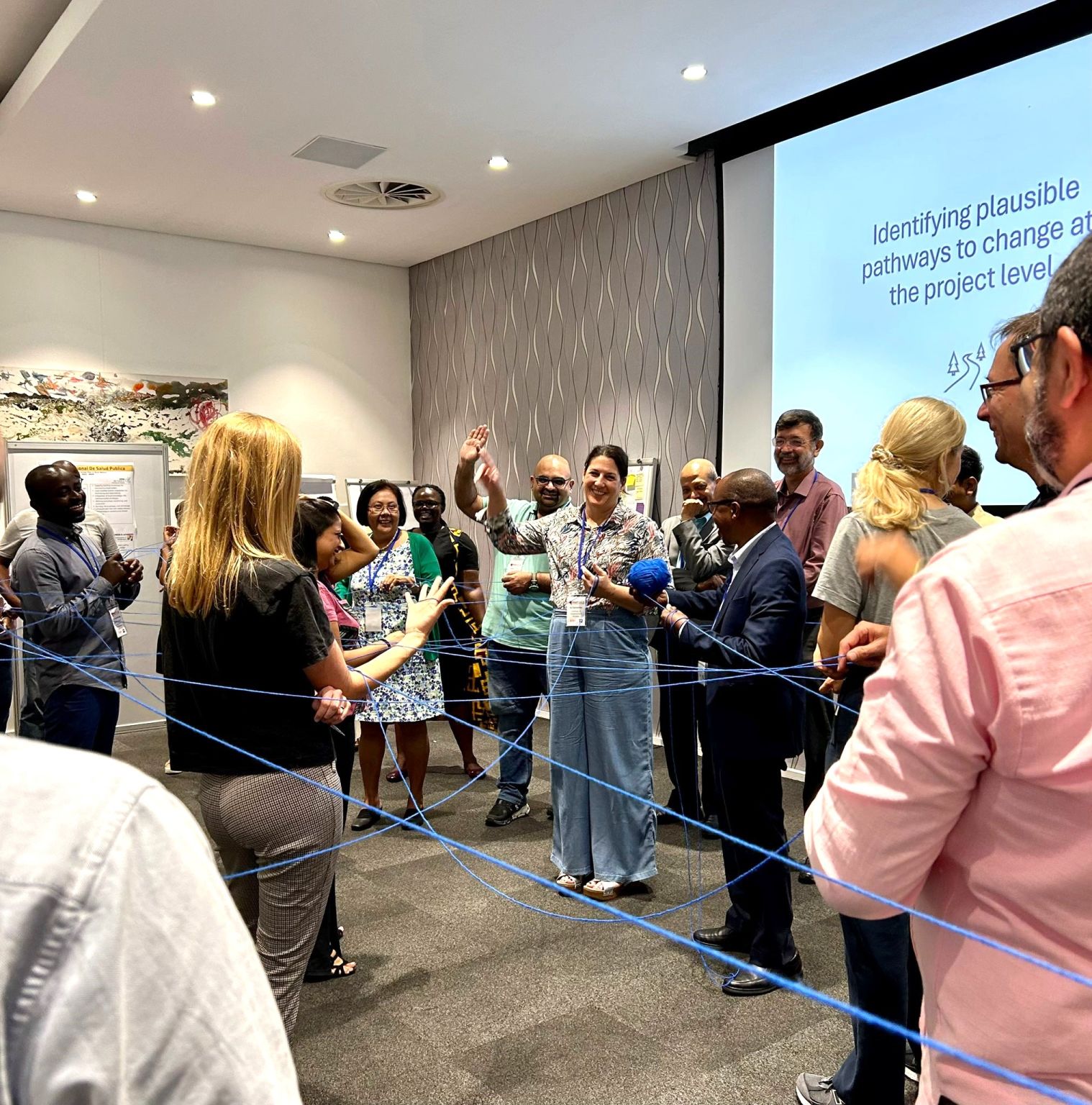 An event at the Cape Town convening involving strings to illustrate connections at a workshop on pathways