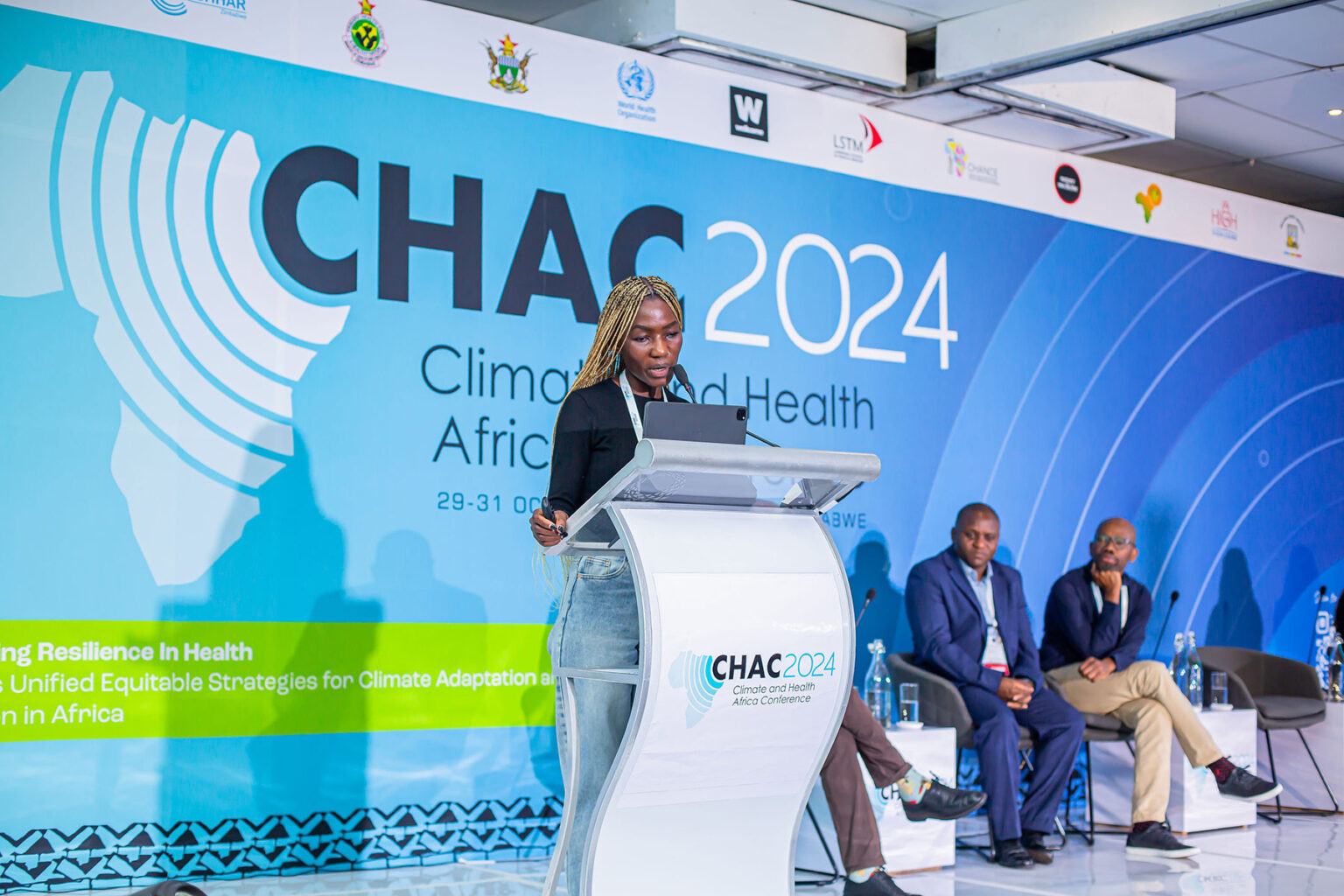 Dr Fortunate Machingura giving a speech on stage at CHAC 2024